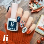 Hi Hybrid gelelakk i julefarger på negl, med flaske